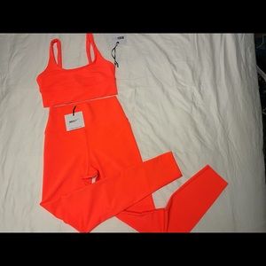 New Beach Riot size medium neon orange leggings and bra